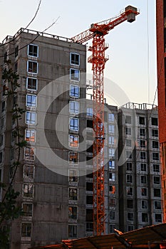 Residential building construction. Construction crane during the construction of a residential high-rise apartment building