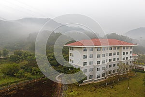 Residential building in morning fog
