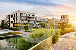 Residential building in the public green park during sunrise