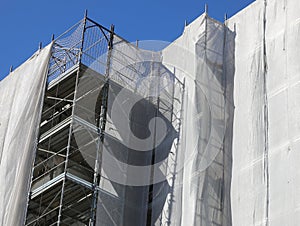 residential building scaffolding during maintenance photo