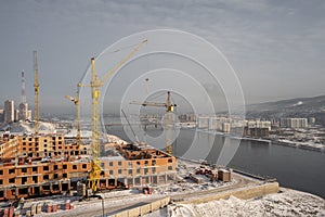 residential building under construction against winter background