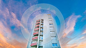 Residential building under pink sky at dusk