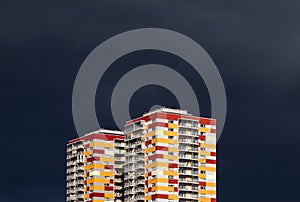 Residential buildings against stormy sky