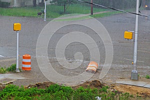 Residential on city street during downpour street flooded after heavy rain