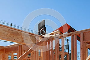 Residential construction home, wood beams with blue sky at construction