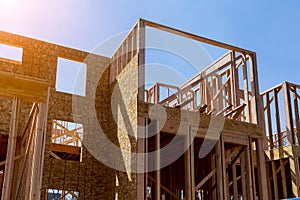 Residential construction home, wood beams with blue sky at construction
