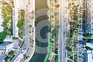 Residential district in a large metropolis with road junctions and houses.