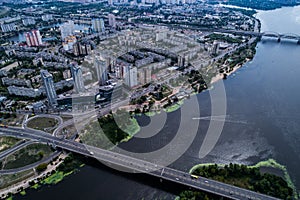 Residential district in a large metropolis with road junctions and houses.