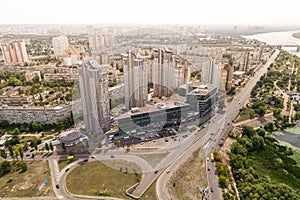 Residential district in a large metropolis with road junctions and houses. View of a newly built residential complex