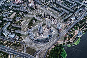 Residential district in a large metropolis with road junctions and houses. View of a newly built residential complex