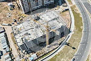 Residential district and multilevel parking garage under construction. aerial view