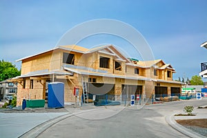 Residential fourplex house under construction. Family townhouse for sale.
