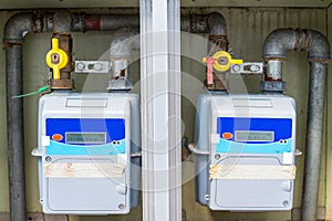 Residential gas meters outside a house