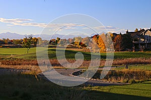 Residential golf course in Broomfield, Colorado with fall colors and the Rocky Mountains