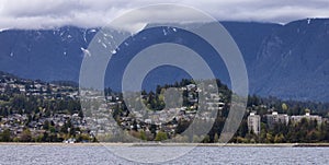 Residential Homes in a modern city with mountain landscape in background.