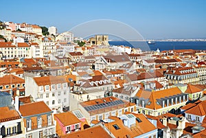 The residential houses of Alfama with Tejo river on the background. Lisbon. Portugal