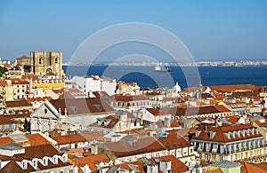 The residential houses of Alfama with Tejo river on the background. Lisbon. Portugal