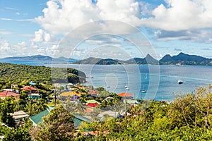 Residential houses at the bay, Mayreau island panorama with Union island in the background, Saint Vincent and the Grenadines