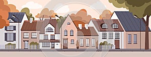 Residential houses exteriors at sunset in empty deserted city. Outside town homes panorama. Dwellings facades row