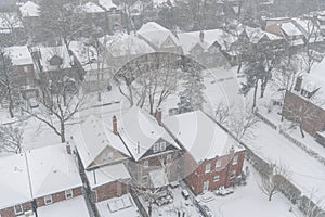 Residential houses and roofs covered with snow in winter snowstorm in Toronto