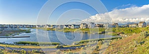 Residential houses surrounding the Oquirrh Lake at Daybreak, South Jordan, Utah