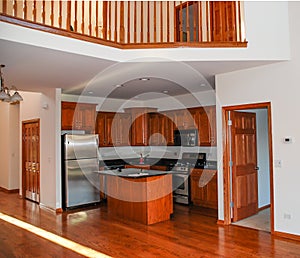 A residential kitchen in a two story townhouse photo