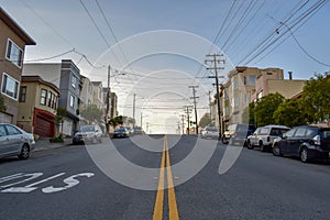 Residential Neighborhood and Crooked Street in San Francisco with Victorian Houses at Sunset