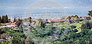 Residential neighborhood on the hills of San Francisco peninsula, Silicon Valley, San Mateo bridge in the background, California