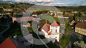 Residential neighborhood in a small village surrounded by green trees. Ponikla, Czech Republic.