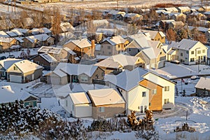 Residential neighborhood in the valley with homes on a white landscape of snow