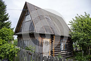 Residential old wooden house from darkened logs