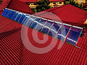 Residential red roof tile with with solar panels