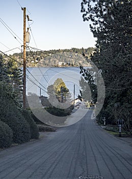 Residential road leading downward to Lake Washington in Seattle