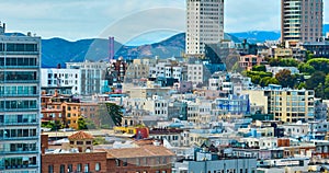 Residential San Francisco aerial of city with tip of Golden Gate Bridge, CA