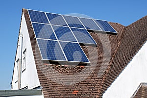 Residential solar panels on house rooftop used to generate electricity