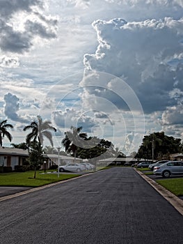 Residential Street with Dramatic Clouds Overhead