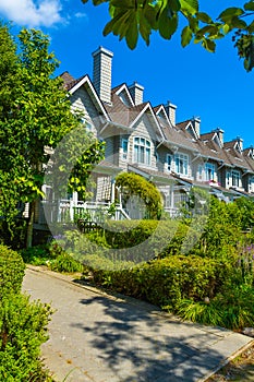 Residential townhouses on sunny day in Vancouver, British Columbia, Canada.