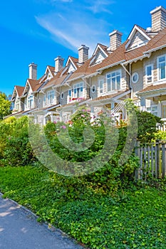 Residential townhouses on sunny day in Vancouver, British Columbia, Canada.