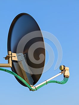 Residential TV receiver satellite dish with low-noise block downconverter LNB. Satellite dish antenna with octo monoblock