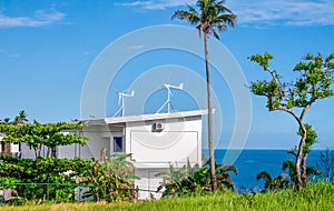 Residential wind turbines on a tropical island in the Philippines.