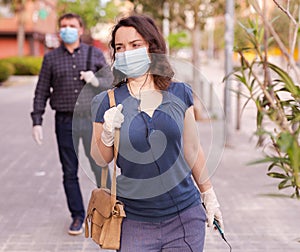 Residents of the city in protective masks against coronavirus on the street