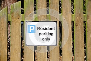 Residents parking only sign with house and car