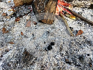 Residual remnant ash from a campfire fireplace in the morning