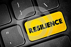 Resilience - the capacity to recover quickly from difficulties, text concept button on keyboard