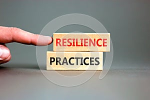 Resilience practices symbol. Concept word Resilience practices typed wooden blocks. Beautiful grey table grey background.