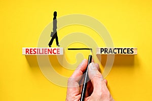 Resilience practices symbol. Concept word Resilience practices typed wooden blocks. Beautiful yellow table yellow background.