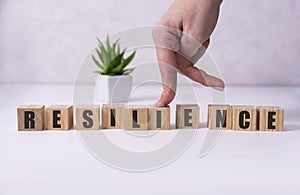 Resilience word concept on cubes on white background.