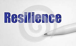 Resilience word concept written with pen on white background