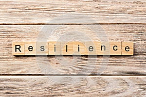 Resilience word written on wood block. resilience text on table, concept