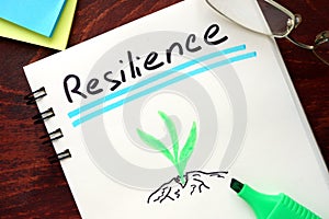 Resilience written on notepad. photo